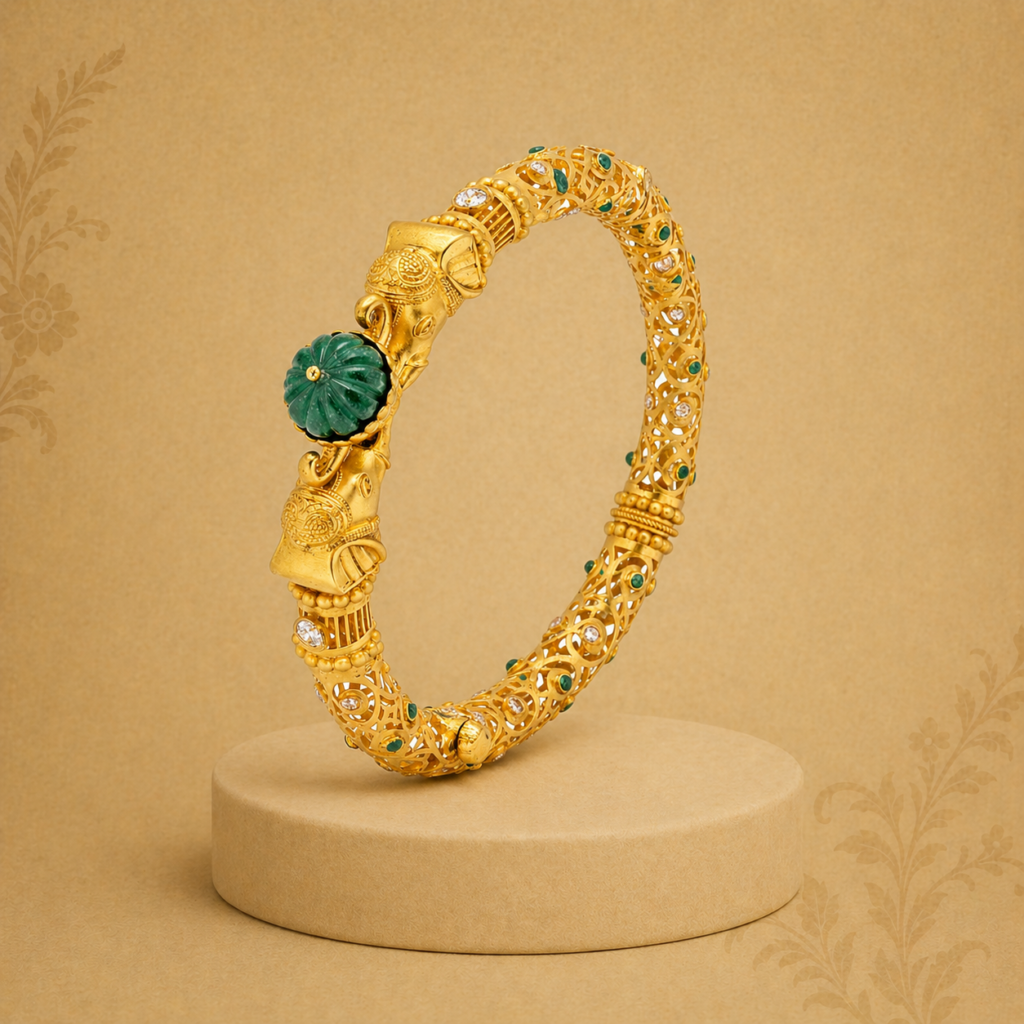 Deccan Collection gold bangle with elephant motifs, emerald detailing and intricate heritage filigree work