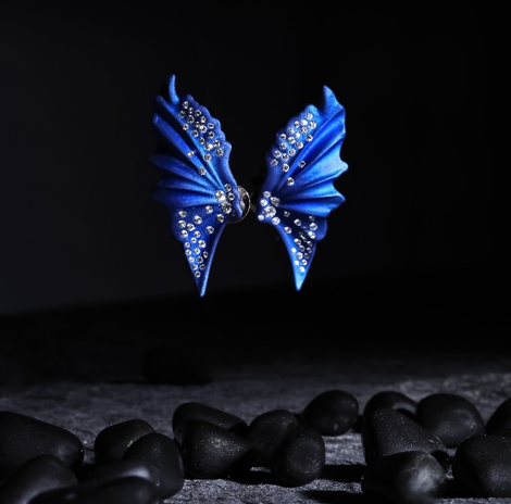 Blue titanium wing earrings with diamond accents, designer statement earrings, contemporary luxury titanium jewellery.