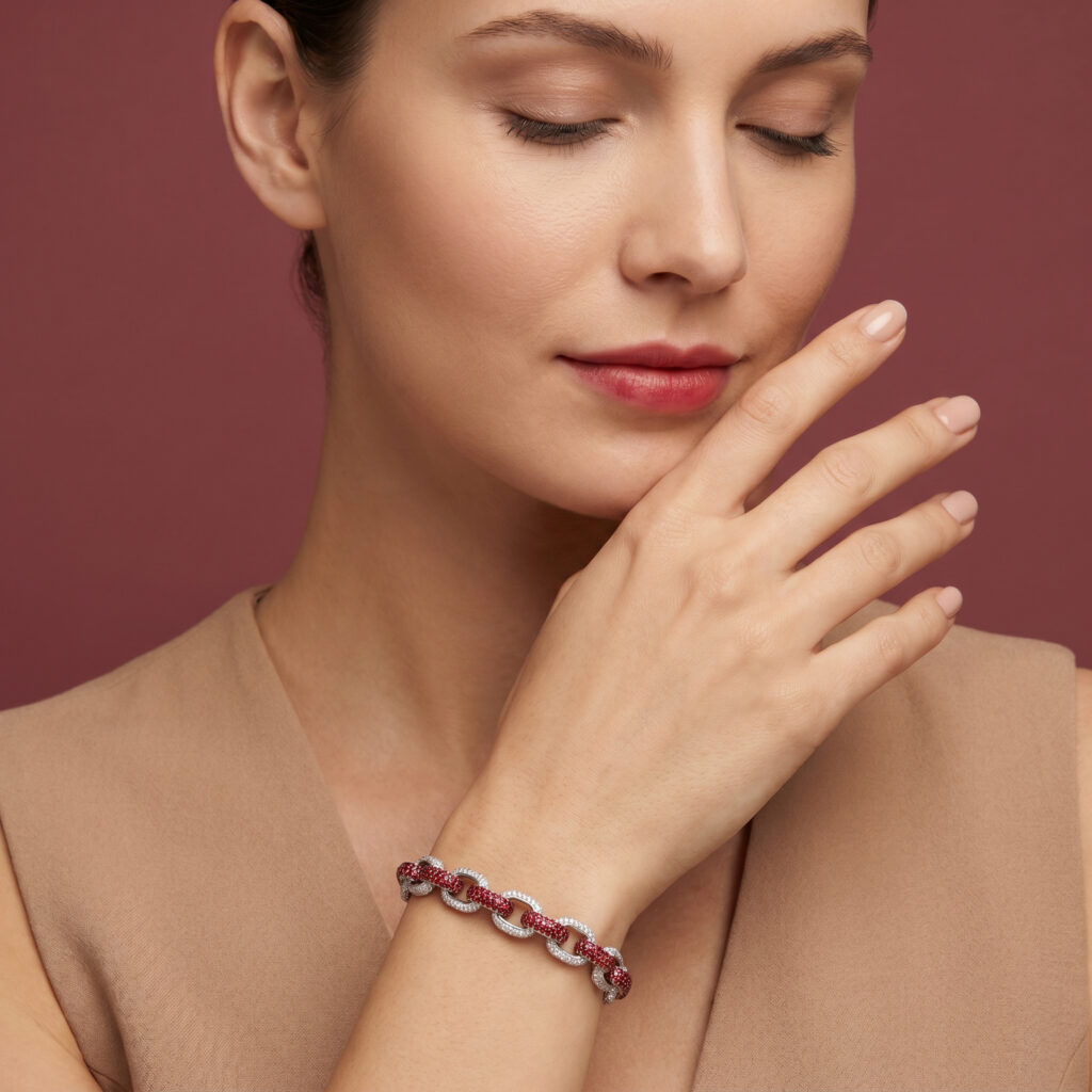 Ruby and diamond bracelet featuring an interlocking link design with vivid red rubies and brilliant diamonds, elegantly styled on the wrist.