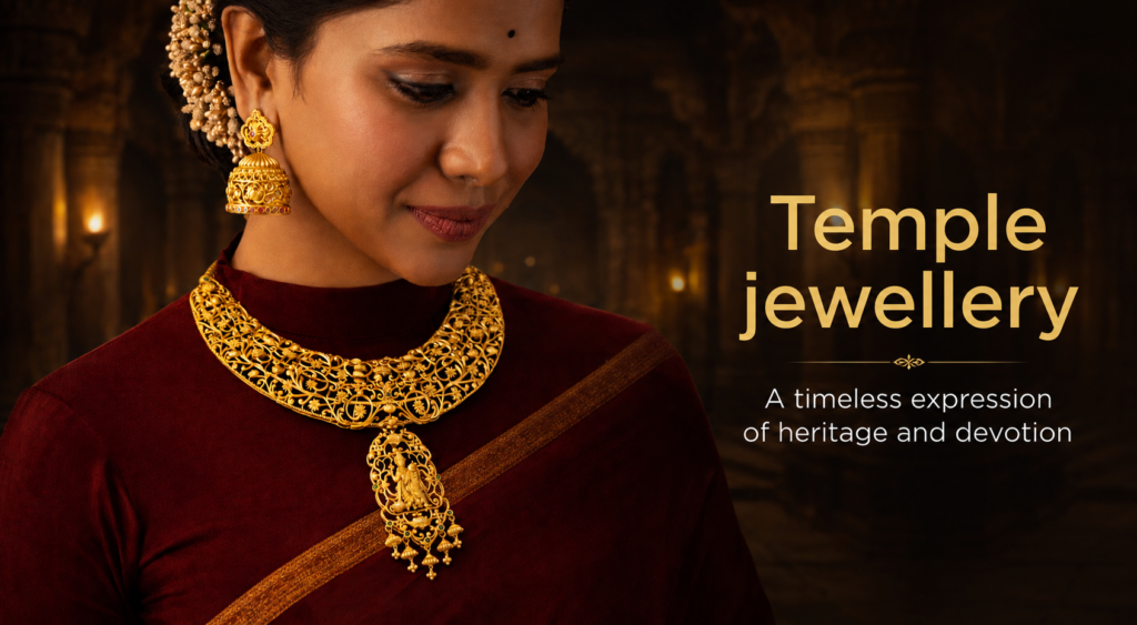 Traditional Indian temple jewellery featuring an intricate gold necklace with deity pendant and matching jhumka earrings, styled with a red saree.